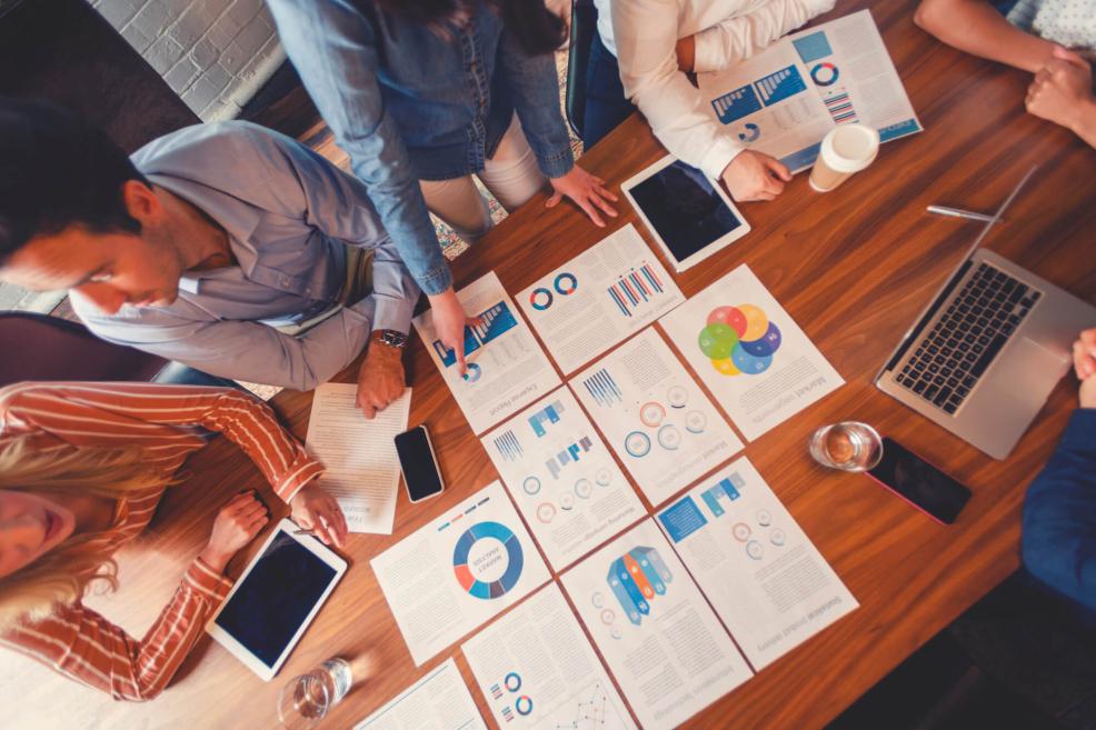 Aerial view of table with printouts of data