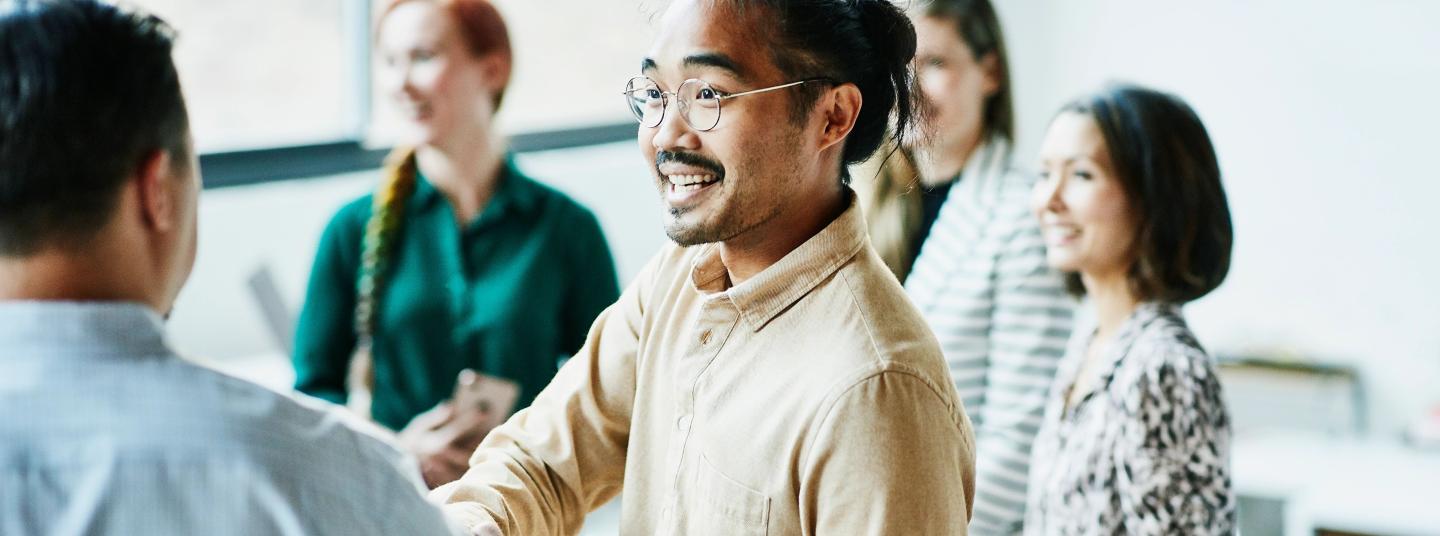 Man shaking hand at event