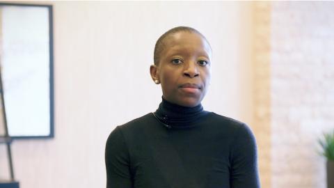 Image of a close up of an attendee at an Acquia event.