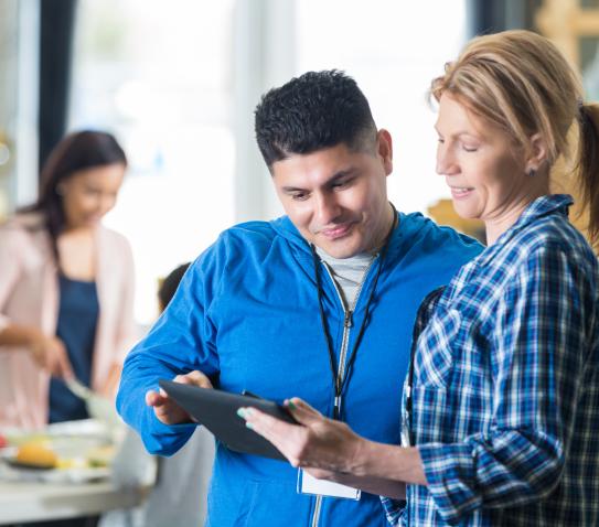 Nonprofit worker holding a tablet