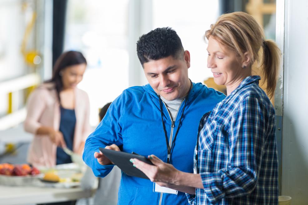 Nonprofit worker holding a tablet