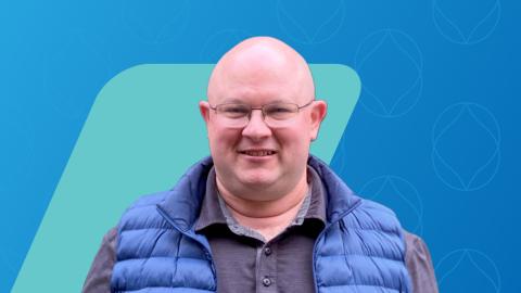 blue background with a teal parallelogram and a headshot of a man