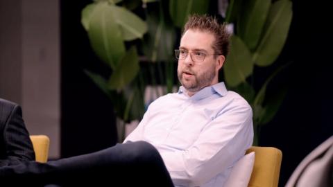 A still shot of Dries Buytaert seated