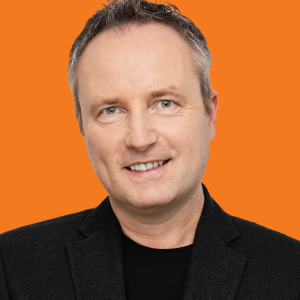 headshot of bernard marr with an orange background