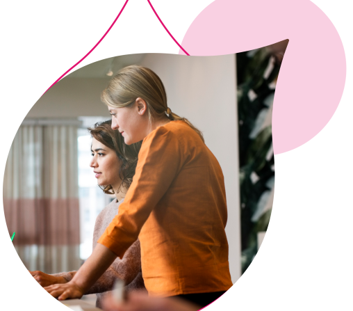 pink acquia droplets with an image of two people standing over a computer