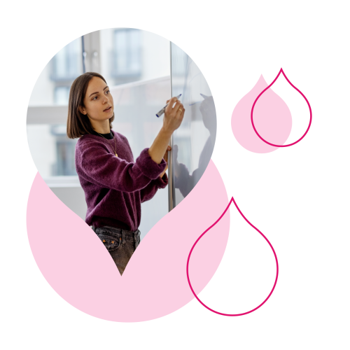 various pink droplets with an image of someone writing on a white board