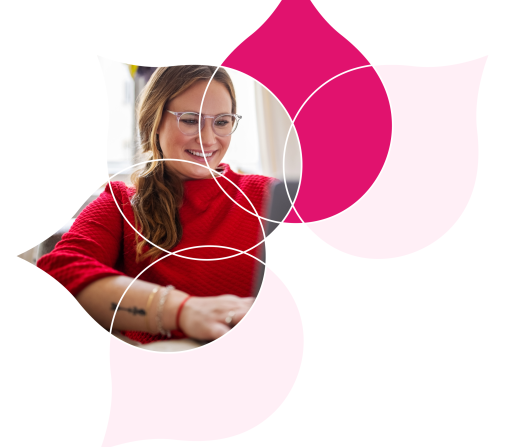 image of a person at a computer surrounded by pink droplets