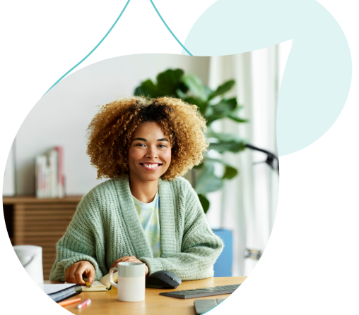 person on a laptop cropped by an acquia droplet surrounded by teal droplets