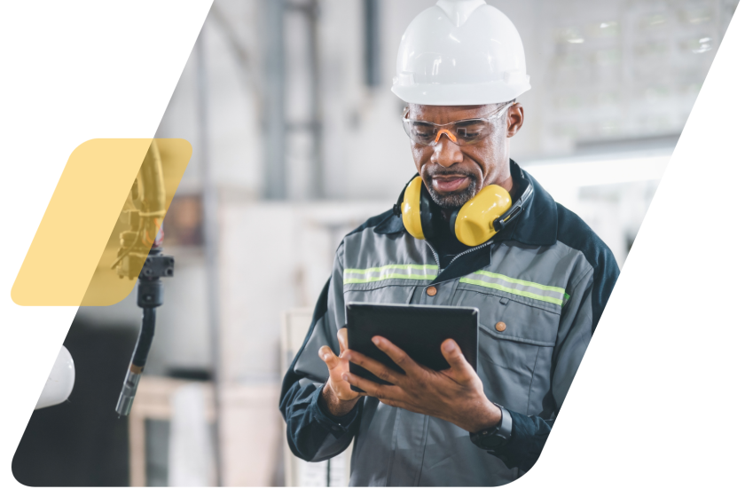 image of a person in a hardhat in a warehouse masked by a parallelogram