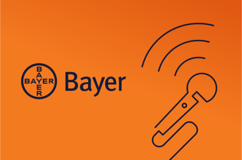 Orange background with mic line art and the Bayer Logo